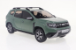Preview: Dacia Duster PH.2.5 2023 khaki 1:18 Modellauto Solido 421186344